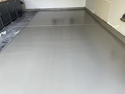 Epoxy floor coating on half garage floor